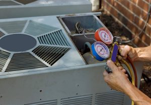 Technician Checking AC Unit with Pressure Gauges, Service AC Unit Near Me