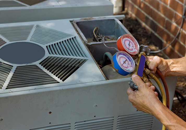 Technician Conducting AC Repair Service with Pressure Gauges